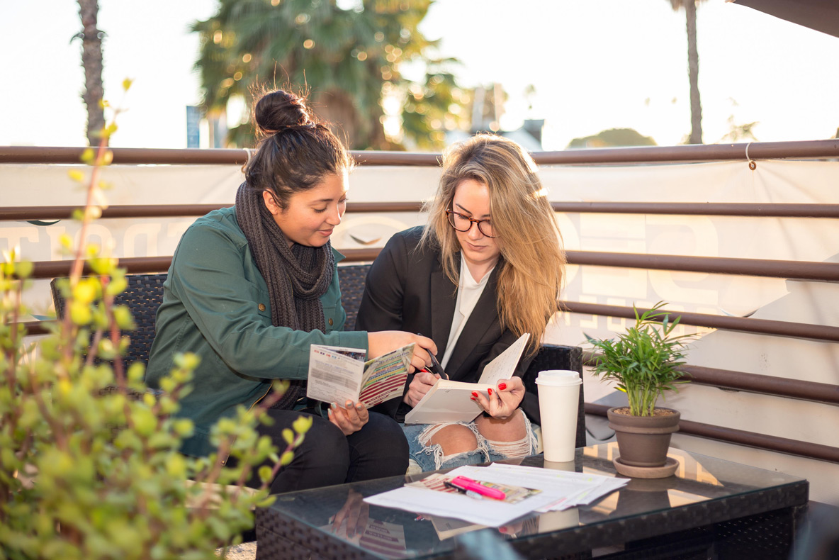 Staff going over client brochure.