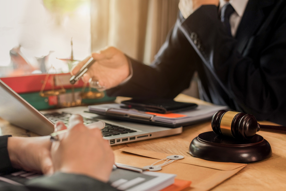 Businessman,And,Male,Lawyer,Or,Judge,Consult,Having,Team,Meeting